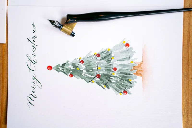 Elegant Christmas card featuring watercolor art and calligraphy. Perfect for the festive season
