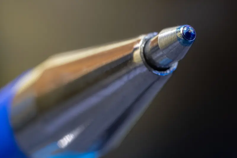 Macro shot highlighting the precision and design of a ballpoint pen tip